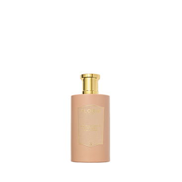 A beige bottle of Floris London Sandalwood & Patchouli Room Fragrance with a gold cap, centered on white, featuring notes of sandalwood and patchouli.