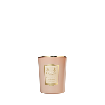 A rose gold Floris London Sandalwood & Patchouli Scented Candle 175g, with a gold label, shown on a white background.