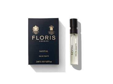A black Floris London Santal box and small bottle of Santal Eau de Toilette rest elegantly on a white background.
