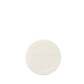 The Santal Shaving Soap Refill by Floris London is a round, white soap embossed with the logo, creating a creamy lather for a smooth, luxurious shave.