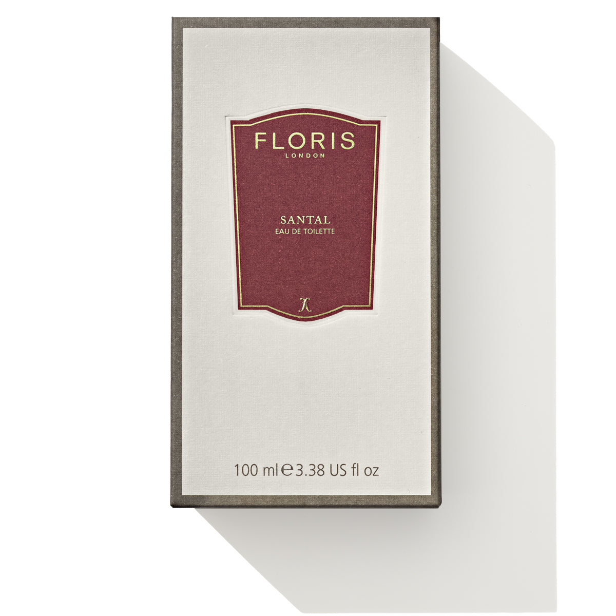 Floris London Santal - Eau de Toilette, 100ml (3.38 fl oz) bottle box with a minimalist design, featuring a red label. This men's signature fragrance evokes the warmth of woody amber and rich sandalwood notes.