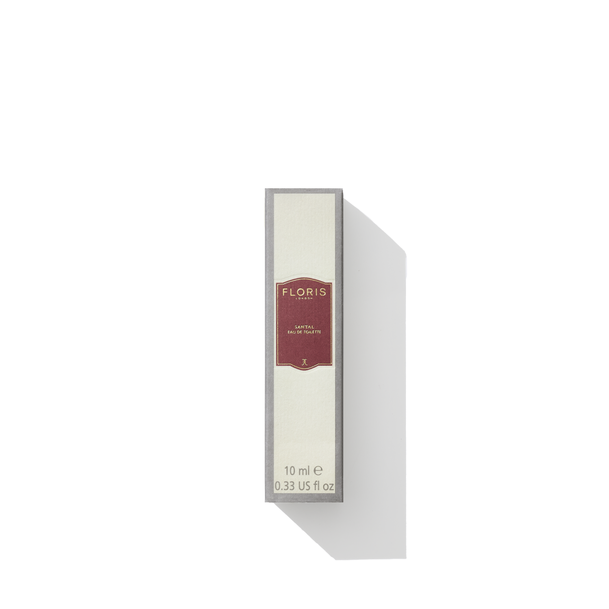 Small rectangular box of Santal - Eau de Toilette by Floris London, 10 ml size, with a white and red label. This men’s signature fragrance features an enticing blend of woody amber and sandalwood notes.