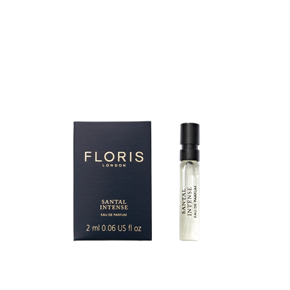 A 2ml sample vial of Floris London Santal Intense Eau de Parfum, shown next to its black and gold box—a contemporary sandalwood fragrance.