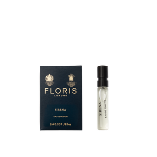 A small vial of Floris London Sirena - Eau de Parfum sits beside its dark blue and gold box, highlighting its fresh floral fragrance.
