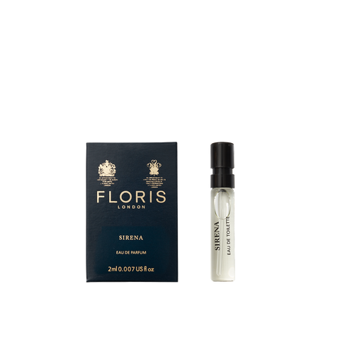 A small vial of Floris London Sirena - Eau de Parfum sits beside its dark blue and gold box, highlighting its fresh floral fragrance.