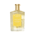 Soulle Ámbar perfume in a clear amber glass bottle with a gold cap and a yellow rectangular label.