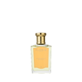 A clear glass bottle with a gold cap, labeled “Floris London Stephanotis Bath Essence,” evokes delicate notes of orange blossom.