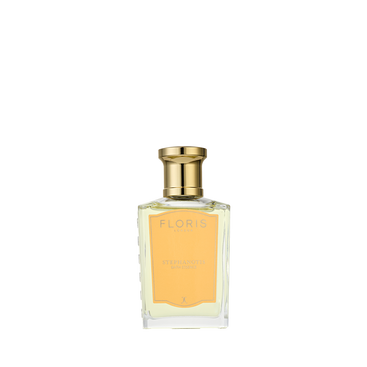 A clear glass bottle of Floris London Stephanotis Bath Essence with a gold cap and pale yellow label, displayed on a white background.