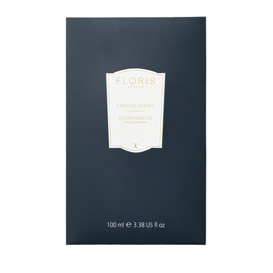 Navy blue Floris London Stephanotis perfume box labeled "Eau de Parfum, 100 ml, Ledger Series," featuring a lush green floral fragrance.