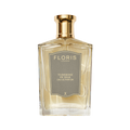 A clear glass bottle of Floris London Tuberose in Silk - Eau de Parfum, a luxurious fragrance with a gold cap and gray label.