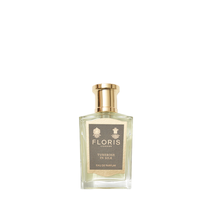 A glass bottle of Floris London Tuberose In Silk Eau de Parfum, gold-capped, with a luxurious tuberose and jasmine fragrance.