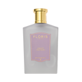 The elegant Frosted Violet Mouthwash by Floris London, with a gold cap and purple label, provides a luxurious fluoride-free dental experience.