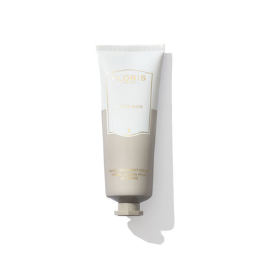 The Floris London "White Rose - Hand Treatment Cream" tube on a white background exudes an elegant charm, reminiscent of a rose in full bloom.