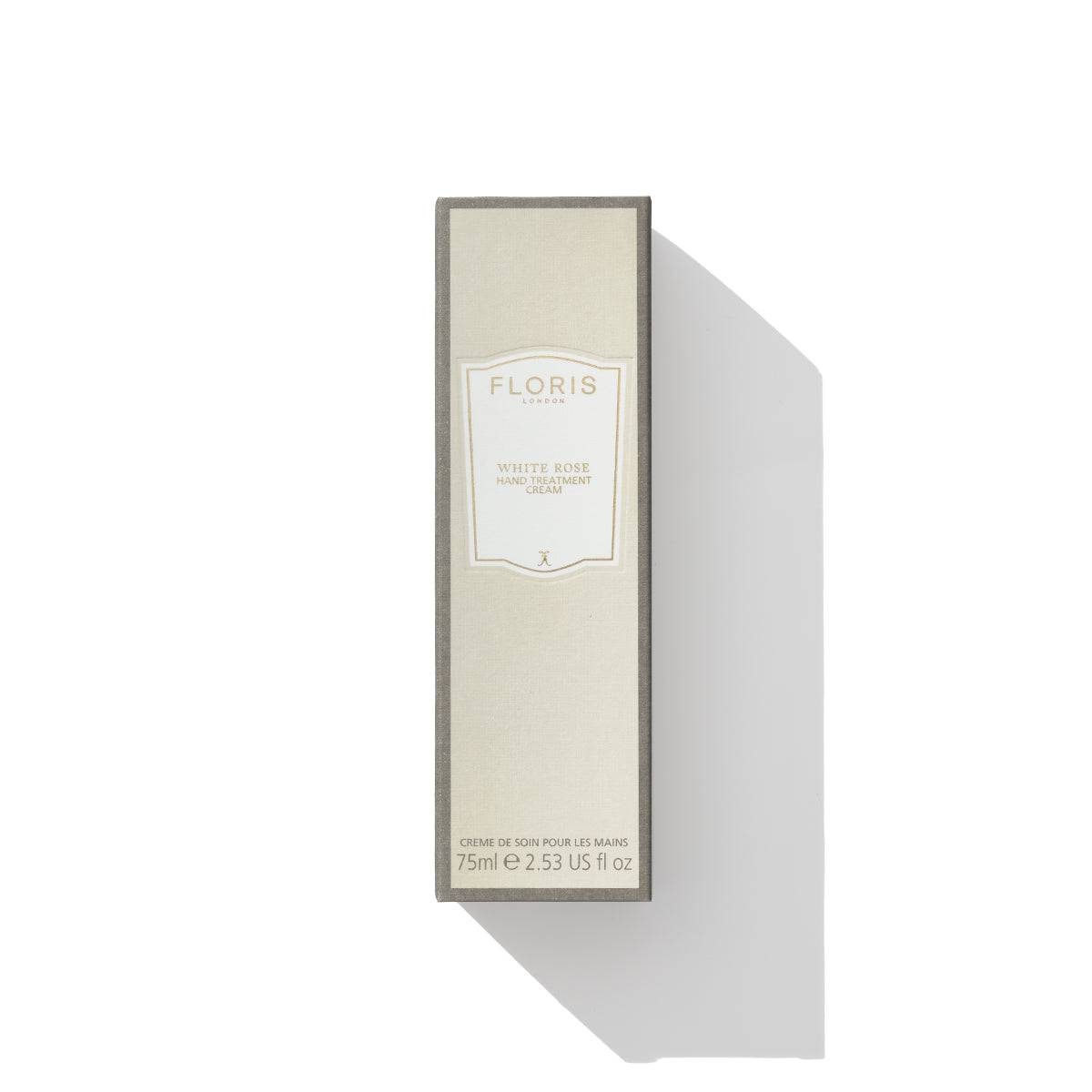 A rectangular box of Floris London's White Rose Hand Treatment Cream, 75ml, sits elegantly against a white background with a visible shadow, exuding an air of silk-like sophistication.