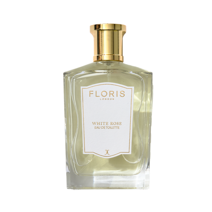A clear glass bottle of Floris London White Rose - Eau de Toilette with a gold cap and white label.