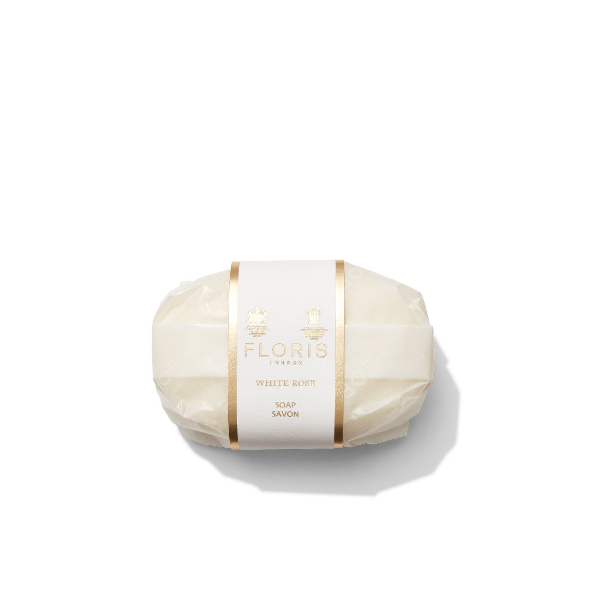 A wrapped Floris London White Rose - Luxury Soap bar, enriched with shea butter and adorned with gold accents, set against a pristine white background.