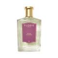 Clear glass bottle of Floris London's Wilde Eau de Parfum, inspired by Oscar Wilde, with a gold cap and purple label celebrating individuality.