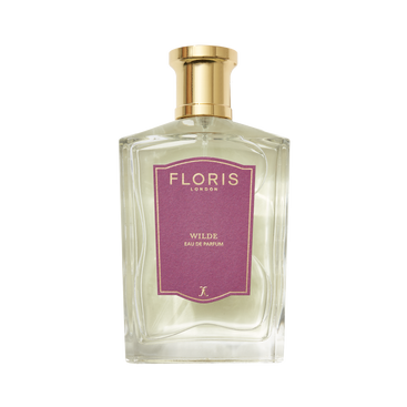 Clear glass perfume bottle with gold cap, labeled "Floris London Wilde - Eau de Parfum"—celebrating creative expression and inspired by Oscar Wilde.
