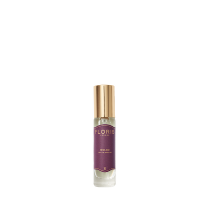 A small glass perfume bottle labeled "Wilde - Eau de Parfum" by Floris London with a gold cap, capturing the spirit of individuality on white.
