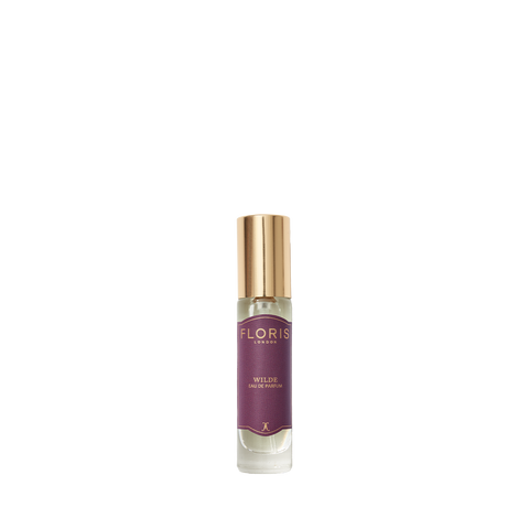 A small glass perfume bottle labeled "Wilde - Eau de Parfum" by Floris London with a gold cap, capturing the spirit of individuality on white.