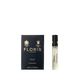 A Floris London Wilde - Eau de Parfum sample vial sits beside its navy blue box, embodying individuality and creative expression.