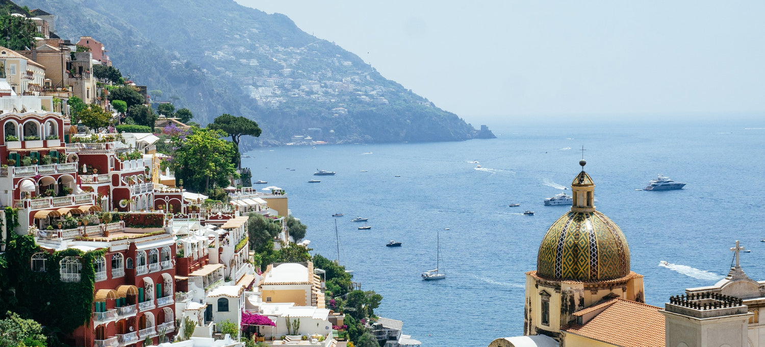 Bergamotto di Positano Eau de Parfum by Floris London US, displayed with a serene ocean backdrop, emphasizing the fresh and citrusy scent.