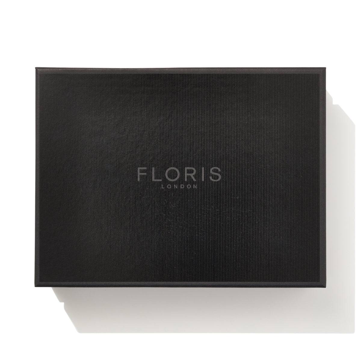 A black rectangular box with "FLORIS LONDON" written in white at the center of the lid, perfect for invigorating your shaving routine with the No. 89 Collection by Floris London.