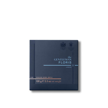 A dark blue box with "Floris London" and "No. 89 - Shaving Soap Refill 100g" text on the front, featuring a rich English gentleman's fragrance.