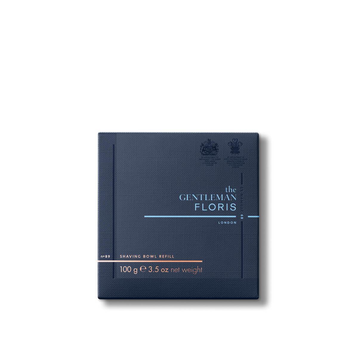 Dark blue packaging of the Floris London Elite Shaving Bowl Refill 100g on a white background, showcasing a luxurious triple-milled shaving soap enhanced with nourishing shea butter.
