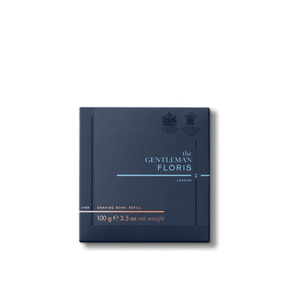 Dark blue packaging of the Floris London Elite Shaving Bowl Refill 100g on a white background, showcasing a luxurious triple-milled shaving soap enhanced with nourishing shea butter.