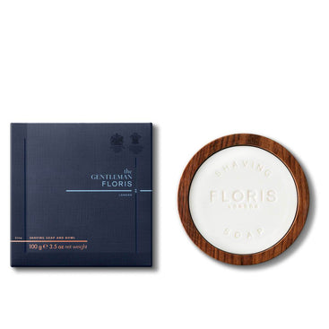 An Elite - Shaving Soap & Bowl from Floris London, enriched with shea butter, sits beside its blue square packaging, both elegantly labeled "The Gentleman Floris.